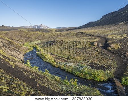 Icelandic Landscape With Blue River Stream And Lush Green Vegatation At Iceland On Laugavegur Hiking