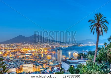 Naples In Italy With Mount Vesuvius At Dusk