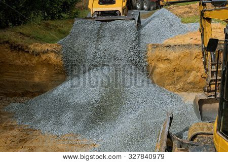 Excavator Removing Unloading Gravel In The Construction Works Of Foundation