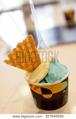 Scoop Of Delicious Gelato Ice Cream Blue Yellow Color Bubble Gum And  Durian Flavor With Cracker