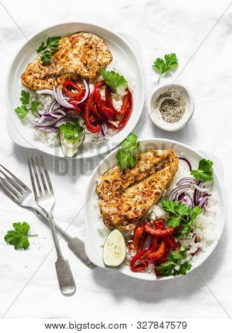 Baked Spicy Chicken Breast With Sweet Pepper And Rice -  Delicious Mexican Style Lunch On A Light Ba