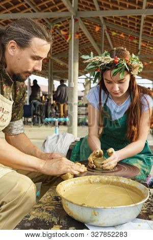Moldavian, Krymsk, Russia-05 October 2019: A Girl Under The Guidance Of A Craftsman Makes A Pitcher 