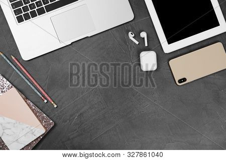 Flat Lay Composition With Phone And Tablet On Grey Stone Table, Space For Text. Designer's Workplace