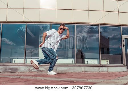 Dancer Dancing Break Dance, Hip Hop. In Summer City, Background Glass Windows. Active Youth Lifestyl