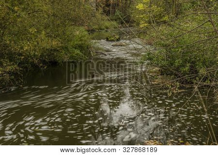 River Lomnice In South Of Bohemia With Bushes Near Big Railway Bridge Near Ostrovce Village