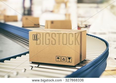 Cardboard Boxes On Conveyor Rollers Ready To Be Shipped By Courier For Distribution