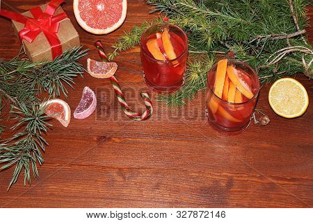 Christmas Hot Mulled Wine With Lemon And Cinnamon On A Festive Wooden Table. Christmas Blanks With G