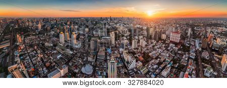 Wide Panoramic View Of Bangkok, Thailand. Cityscape With Skyscrapers At Sunset
