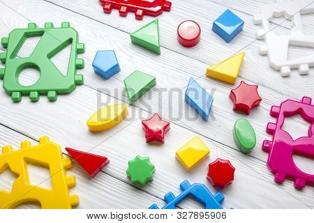 Kids Educational Developing Toys Frame On White Background. Top View. Flat Lay. Copy Space For Text