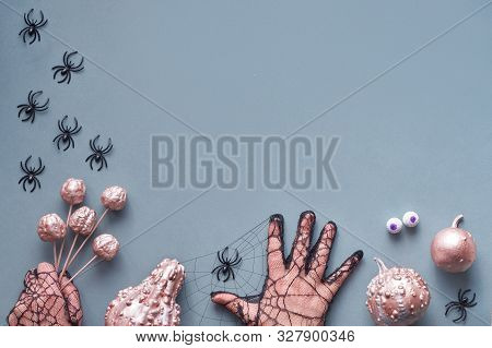 Creative Halloween Flat Lay On Grey Paper Background With Copy-space. Frame Made Of Hands In Black M