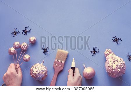 Creative Halloween Flat Lay On Grey Paper On Light Purple Background With Copy-space. Female Hands H
