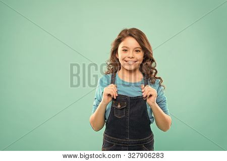 Shes Got A Pretty Smile. Little Girl With Cute Smile On Blue Background. Smiling Kid With White Heal