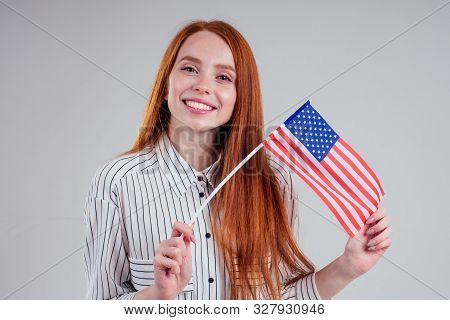 Redhead Woman In Striped Shirt Usa Visa Traveler White Background Studio