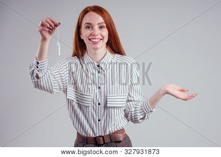 Closeup Photo Of Young Redhead Businesswoman In Striped Shirt Holding Hygiene Pad Choosing Tampon St