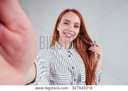 Cheerful Redheared Woman Businesswomen In A Striped Shirt Taking Picture Selfie Photos On Camera Sma