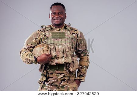 African American Soldier With Folded Arms Standing In White Studio