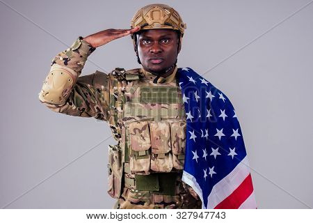 African American Soldier With Folded Arms Standing In White Studio