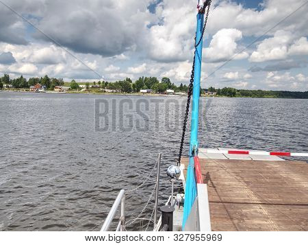 Shipping On Ferry Boat Ship With Open Ramp And Empty Car Deck. Wooden Board For Cars And Passengers