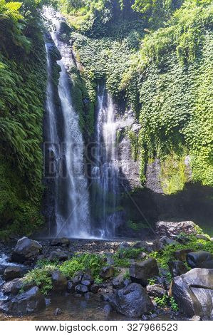 Sekumpul Waterfalls In Bali, Indonesia.waterfall In Green Forest. Triple Tropical Waterfall Sekumpul