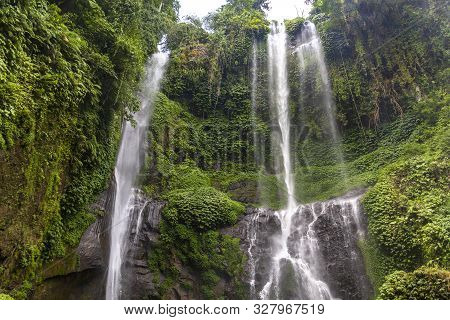 Sekumpul Waterfalls In Bali, Indonesia.waterfall In Green Forest. Triple Tropical Waterfall Sekumpul