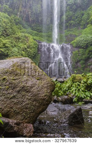 Sekumpul Waterfalls In Bali, Indonesia.waterfall In Green Forest. Triple Tropical Waterfall Sekumpul