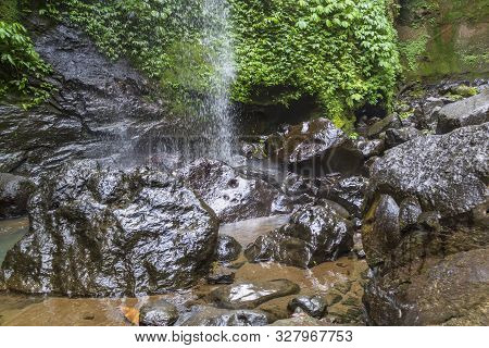Sekumpul Waterfalls In Bali, Indonesia.waterfall In Green Forest. Triple Tropical Waterfall Sekumpul