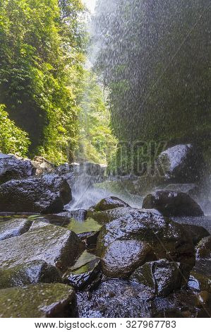 Sekumpul Waterfalls In Bali, Indonesia.waterfall In Green Forest. Triple Tropical Waterfall Sekumpul
