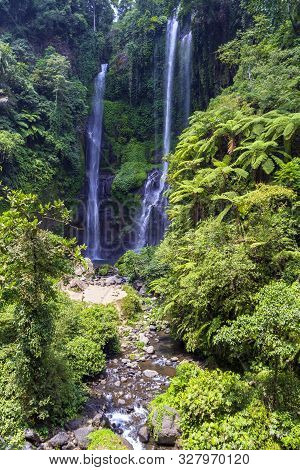 Sekumpul Waterfalls Surrounded By Tropical Forest In Bali, Indonesia.