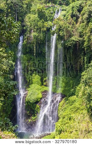 Sekumpul Waterfalls In Bali, Indonesia.waterfall In Green Forest. Triple Tropical Waterfall Sekumpul