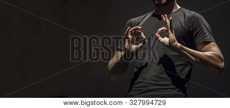 Sign Language Man Interpreter Gestures Over Stage During Public Event. Empty Copy Space For Editor C