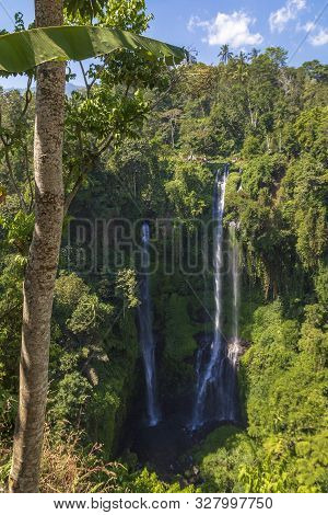 Sekumpul Waterfalls Surrounded By Tropical Forest In Bali, Indonesia.