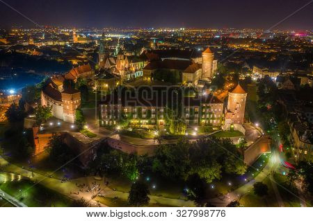 Night Aerial Panorama Of Wawel Hill In Cracow With Old Most Famous Polish Castle. Interesting Travel