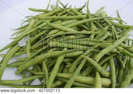 Selective Focus Of Radish Pods Heap Isolated On White Background. Fresh Organic Indian And Pakistani