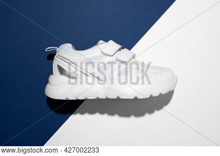 Top View Macro On One White Teen Sneaker On The Side With Velcro Fasteners For Easy Footwear On A Tr