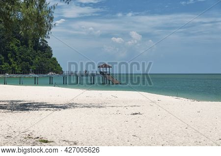 A Pier Leading Out Into The Straits Of Malacca At Kerachut Beach Within The Penang National Park In 