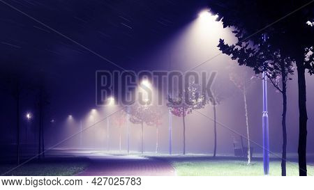 Lanterns On The Street Of The Night City In The Fog.