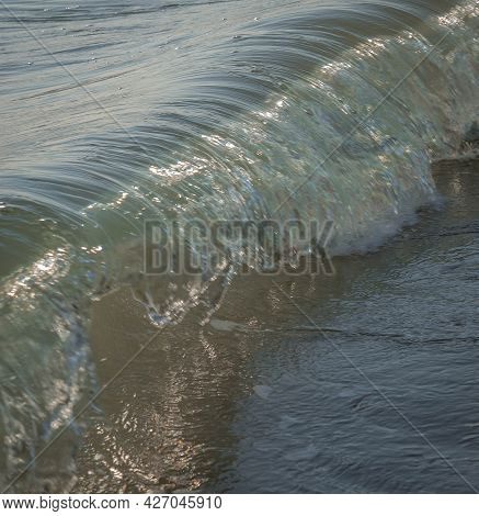 Colored Sea Waves With Splashes And White Breakers In Circeo Park, Sabaudia, Italy