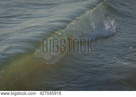 Colored Sea Waves With Splashes And White Breakers In Circeo Park, Sabaudia, Italy