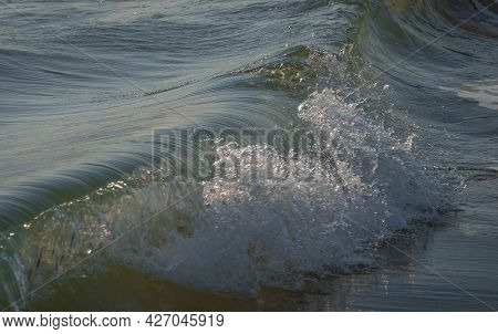 Colored Sea Waves With Splashes And White Breakers In Circeo Park, Sabaudia, Italy
