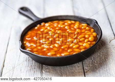 Baked beans, classic american staple food served in a skillet