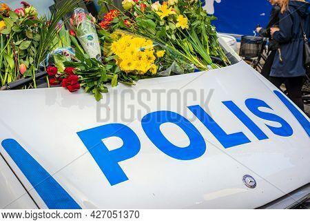 STOCKHOLM, SWEDEN - April 09, 2017: Flowers on a police van. truck attack in central Stockholm, Sweden