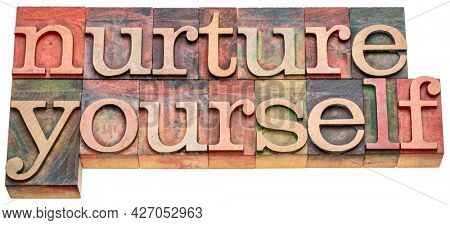 nurture yourself - inspirational word abstract in vintage letterpress wood type, self-care concept