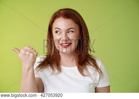 Intrigued Charismatic Redhead Middle-aged Woman Smiling Temtation Interest Pointing Looking Left Cur