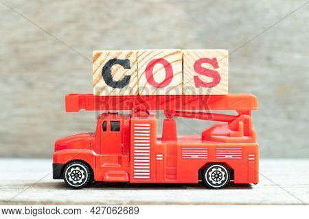 Fire Ladder Truck Hold Letter Block In Word Cos (abbreviation Of Cost Of Sales, Class Of Service, Co