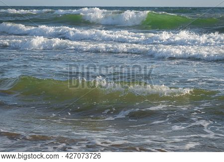 Colored Sea Waves With Splashes And White Breakers In Circeo Park, Sabaudia, Italy