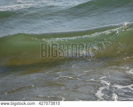 Colored Sea Waves With Splashes And White Breakers In Circeo Park, Sabaudia, Italy