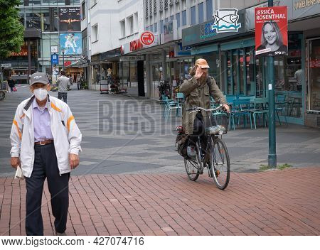 People On The Street Wearing Masks And Without Masks During The Second Year Of Coronavirus In Bonn,