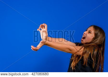 Pretty Preteen Girl Throwing An Imaginary Kame Kame Ha With A Lot Of Anger To Win The Fight Isolated
