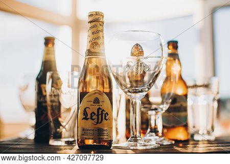 Lviv, Ukraine - December 1, 2017: Leffe Beer Bottle And Glass In Warm Sunny Light On Background Of G