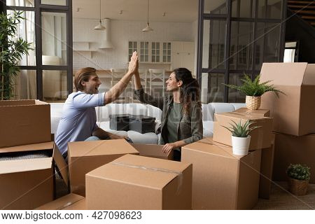 Joyful Family Couple Apartment Renters Buyers Celebrate Starting Independent Life